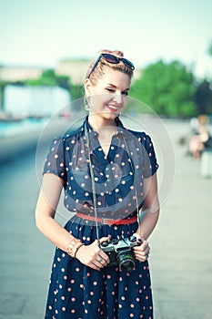 Beautiful young girl in fifties style with braces winking