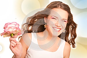 Beautiful young girl with flower.