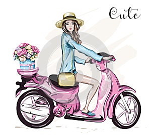 Beautiful young girl in hat with cute pink scooter.