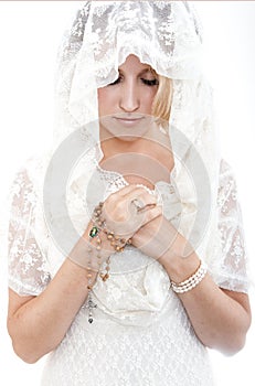 Beautiful young girl in a hat with earsyoung girl praying to god