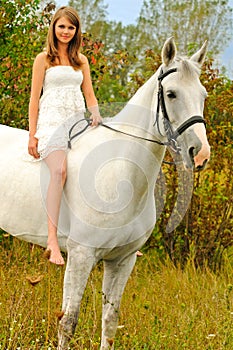 Beautiful young girl and horse