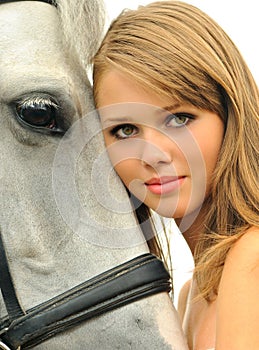 Beautiful young girl and horse
