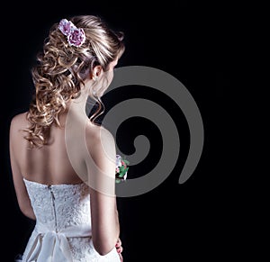 Beautiful young girl in the image of the bride, beautiful wedding hairstyle