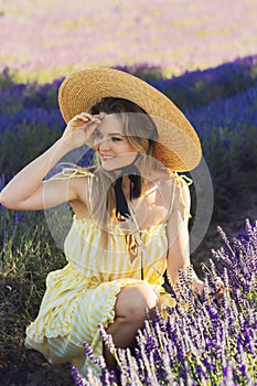 Beautiful and young girl in a lavender field photo