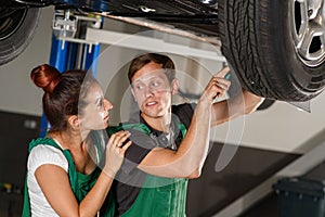 A beautiful and young girl locksmith conducts diagnostics of the