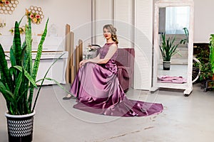 Beautiful young girl in a lush elegant dress in the Studio.