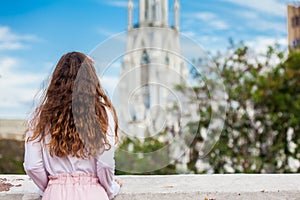 Beautiful young girl on the Ortiz Bridge looking at the famous gothic church of La Ermita built on 1602 in the city of Cali in Col photo