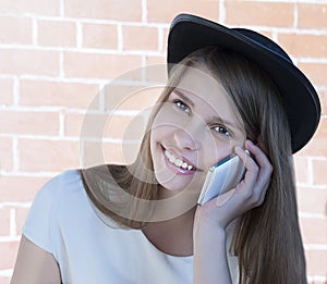 Beautiful young girl with phone.