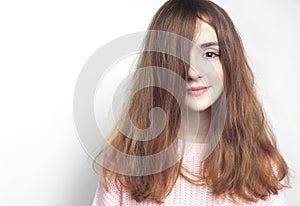 Beautiful young girl portrait,feemale teen ager on empty space background.Red hair child photo