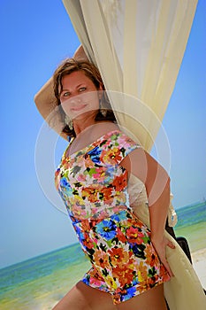 Beautiful young girl posing on the beach