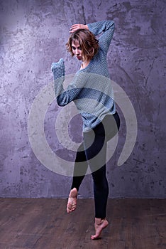 Beautiful young girl posing in a dance in the studio, fashion photo.