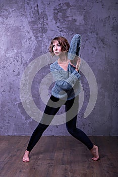 Beautiful young girl posing in a dance in the studio, fashion photo.