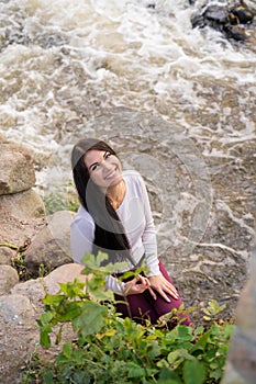 beautiful young girl posing near the river