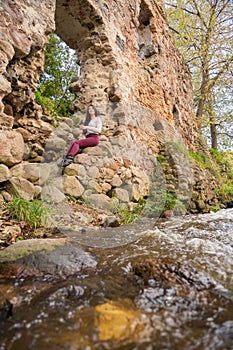 beautiful young girl posing near the river