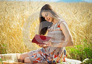 Beautiful young girl reading book