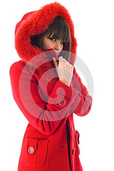The beautiful Young girl in a red coat
