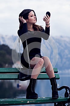 Beautiful young girl resting on the sea photo