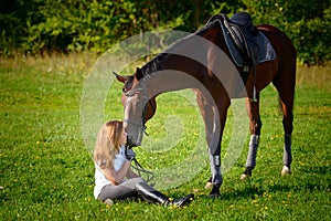 Beautiful young girl rider and her horse