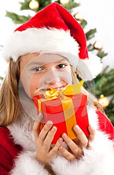 Beautiful young girl in Santa Claus clothes