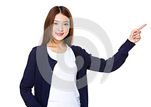 Beautiful young girl showing copy space