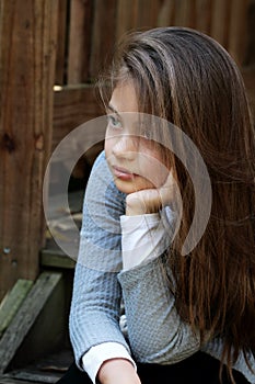 Beautiful Young Girl Sitting on Steps