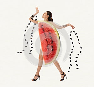 Beautiful young girl with slim body, wearing watermelon clothes over white background. Summer fruits. Contemporary art