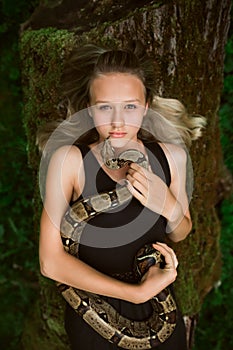 Beautiful young girl with snake