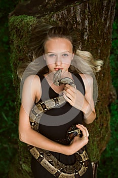 Beautiful young girl with snake
