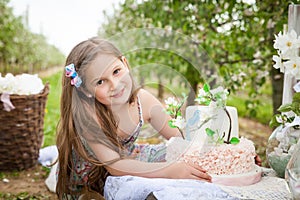 Beautiful young girl in spring garden