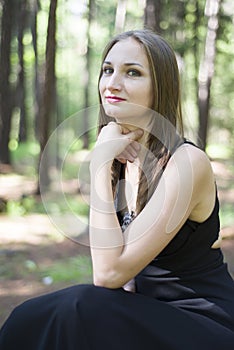 Beautiful young girl walking in a fairy forest.