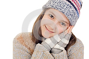 Beautiful young girl in warm winter clothes smiles