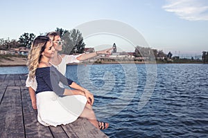 Beautiful young girls enjoying next to river