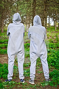 Beautiful, young guys in tracksuits play sports in the park outdoors. Healthy lifestyle