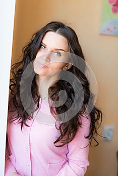 Beautiful young happy smiling woman with long curly hair