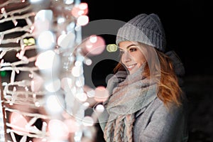 Beautiful young happy woman smiling in a knitted vintage hat
