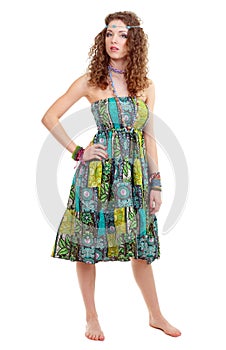 Beautiful young hippie woman in green dress