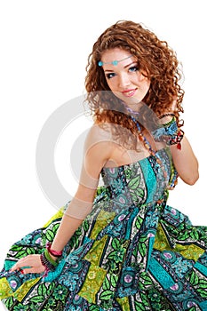 Beautiful young hippie woman in green dress