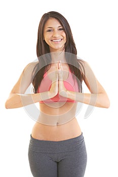 Beautiful young hispanic female doing yoga