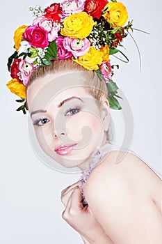 Beautiful young lady with flowers in her hair