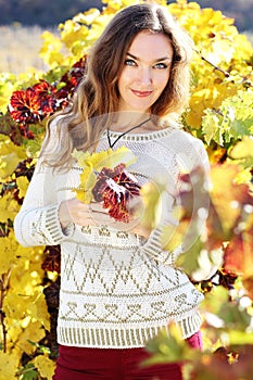 Beautiful young lady in grape vineyard