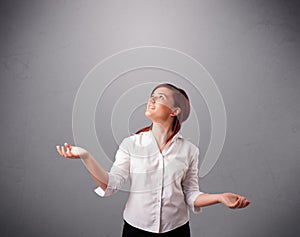 Beautiful young lady juggling with copy space