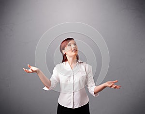 Beautiful young lady juggling with copy space