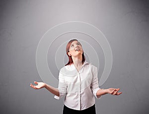 Beautiful young lady juggling with copy space