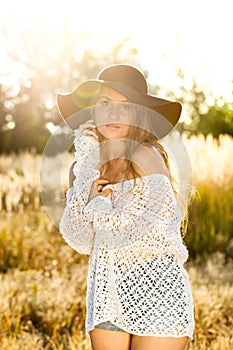 Beautiful young lady model in field - sunrise shot