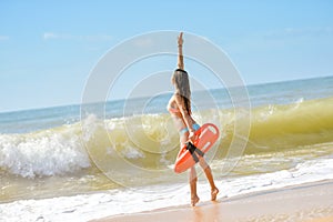 Beautiful young lady with orange lifesaver