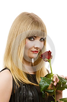 Beautiful young lady with red rose.