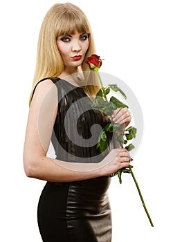 Beautiful young lady with red rose.