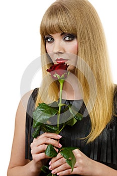 Beautiful young lady with red rose.