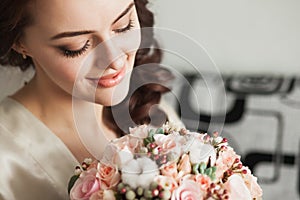 Beautiful young lady with soft make up and flowers