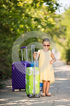 Beautiful young lady travelling with a suitcase